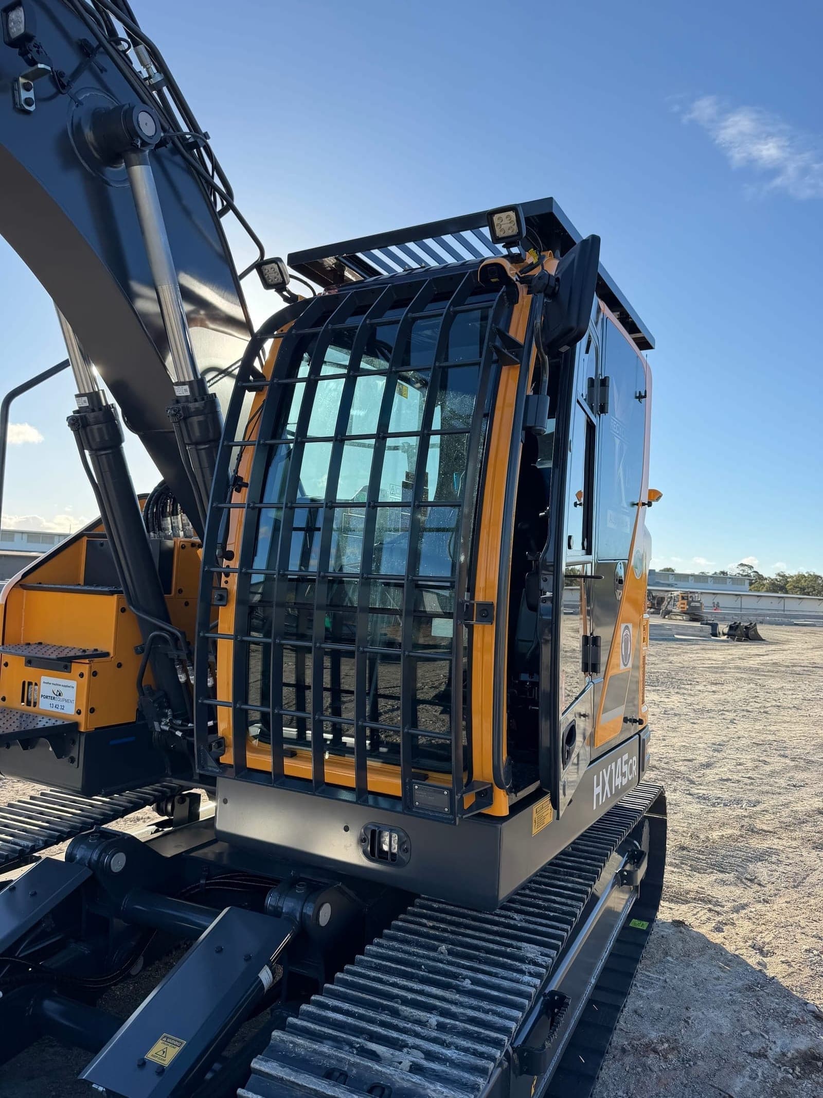 HX145CR cab with front guarding and Recycling King branding