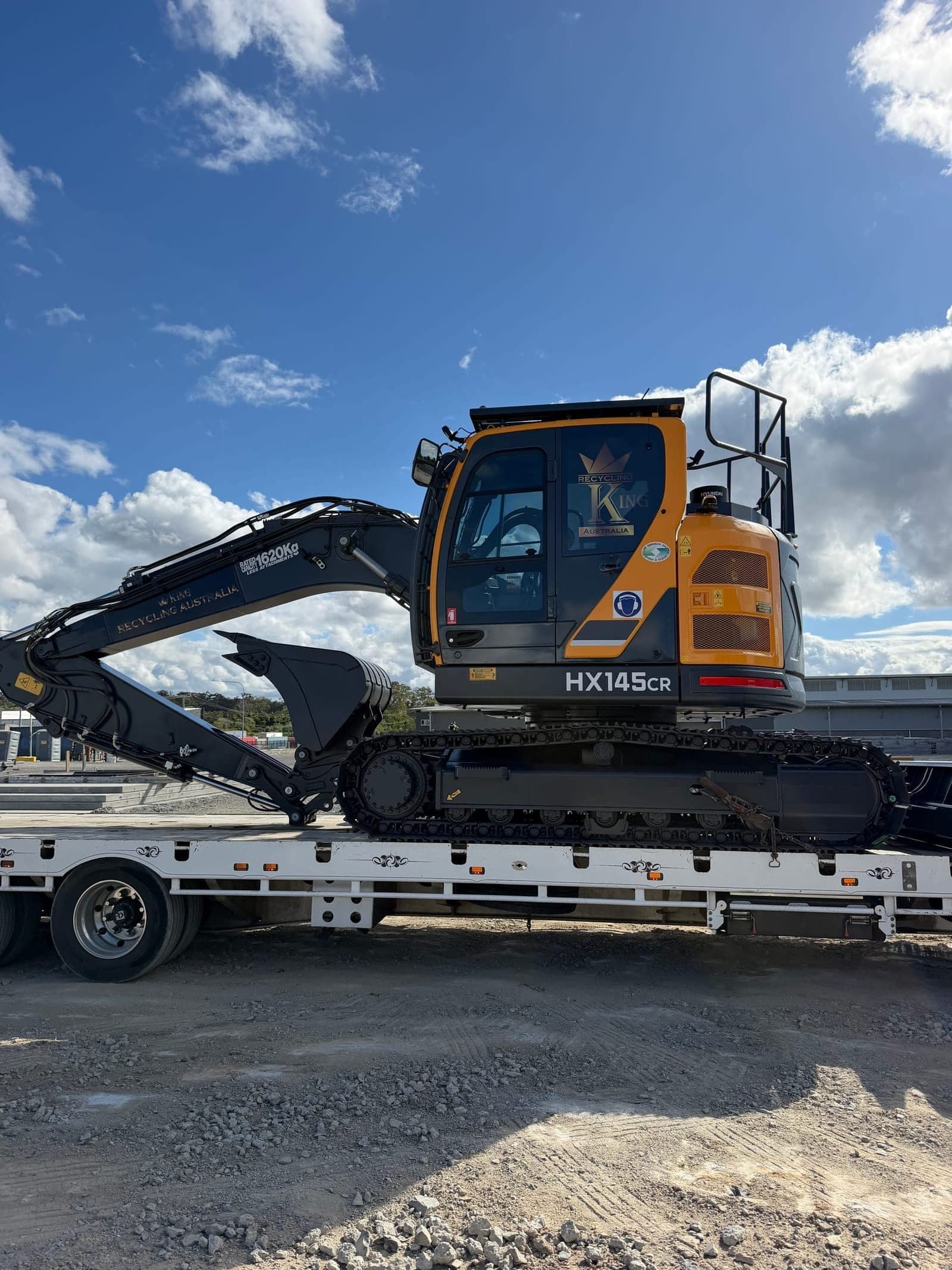 Recycling King HX145CR excavator secured on a float for transport