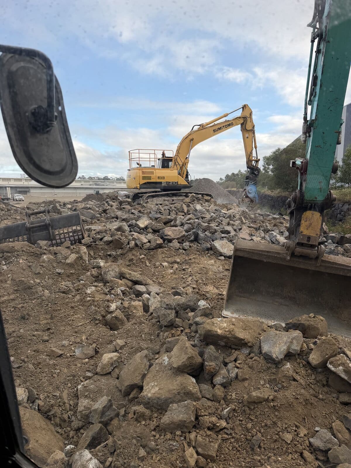 Demolition concrete stockpiled ready for on-site crushing